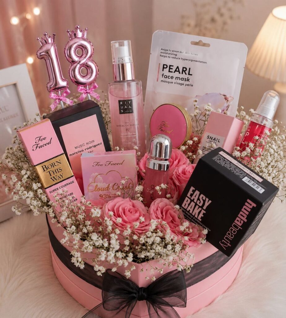 Pink gift box with makeup, skincare, flowers, and 18th birthday balloons.
