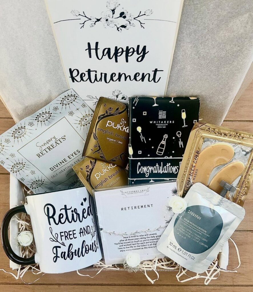 Retirement gift basket with a themed mug, skincare products, and a celebratory card.